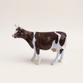 Vache en résine Kuhtag — Vaudoise brun-blanc H15 cm — photo studio