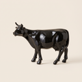 Vache noire brillante en résine H15 cm Kuhtag — photo studio